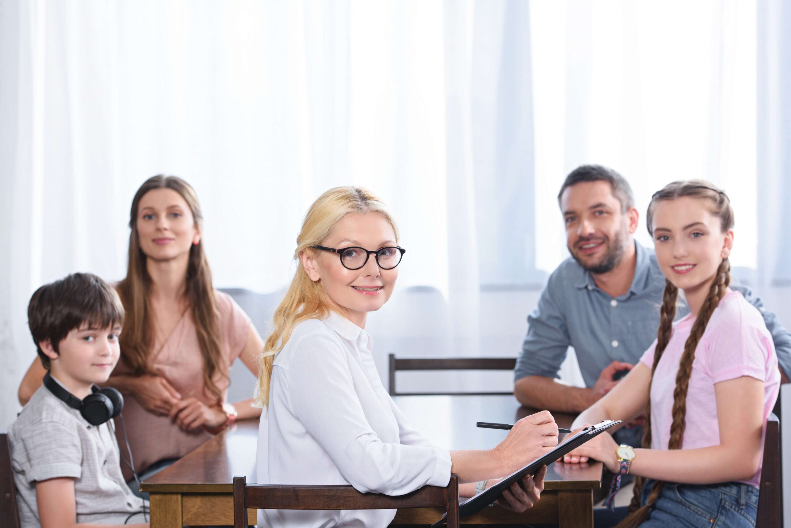 happy-family-and-female-counselor-with-clipboard Health Sciences Program